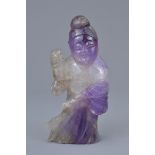 A Chinese carved amethyst figure of a lady.