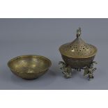 An Eastern bronze incense burner and cover