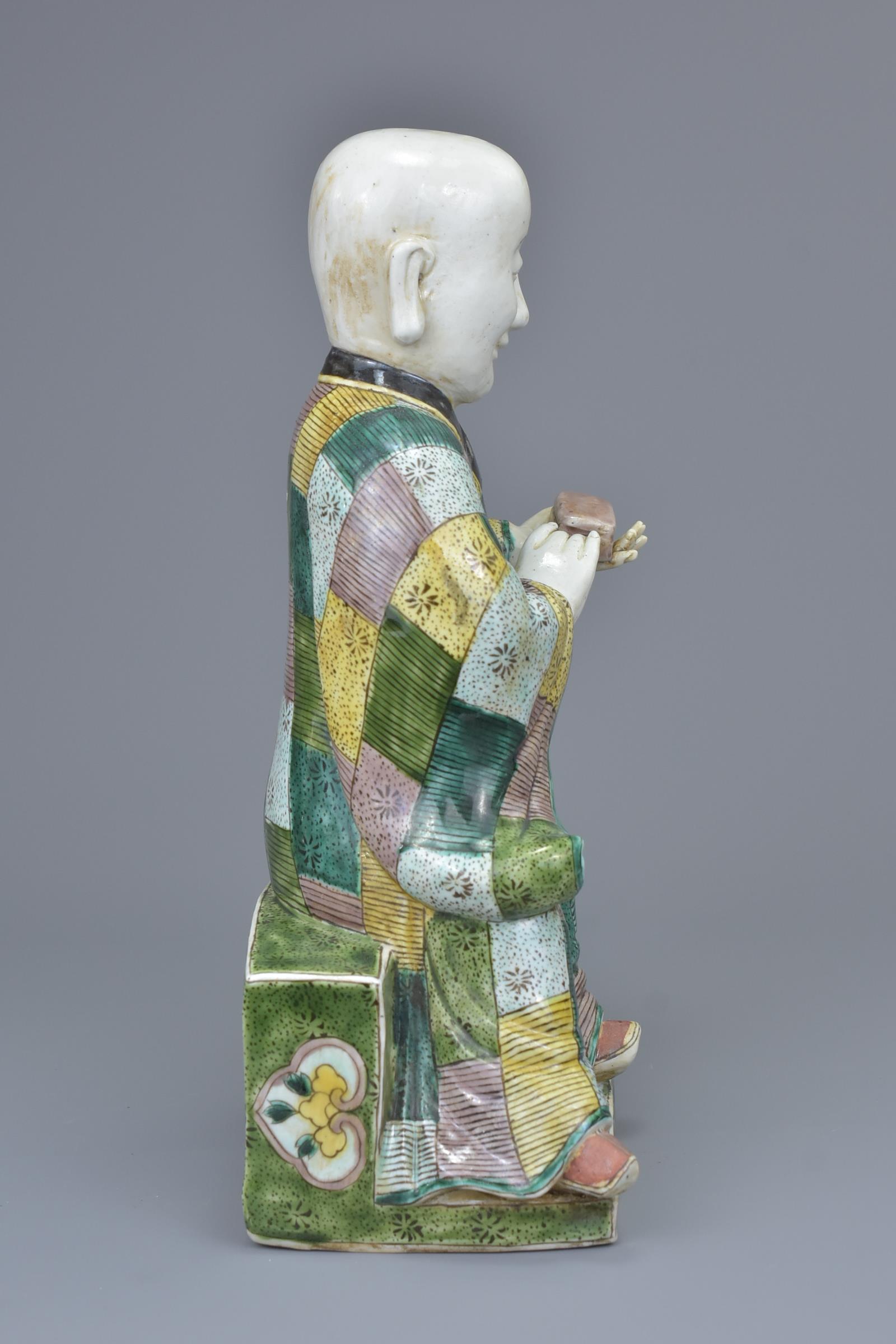 A Chinese 19th C. Famille verte porcelain figure of a 'doctor' - Image 4 of 6