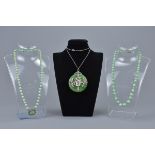 Two Jadeite necklaces and a jade pendant on silver chain.