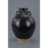 A fine Chinese Tang Dynasty (618-907AD) black-glazed stoneware vase