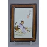 A Chinese early 20th C. Famille rose porcelain plaque