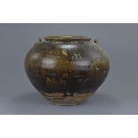 A large Chinese Song Dynasty (960-1279) glazed stoneware jar