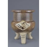 A Chinese / Japanese 19th century stoneware tripod censer / incense burner