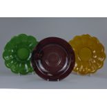 A pair of Chinese Amber and Green fluted Peking glass dishes