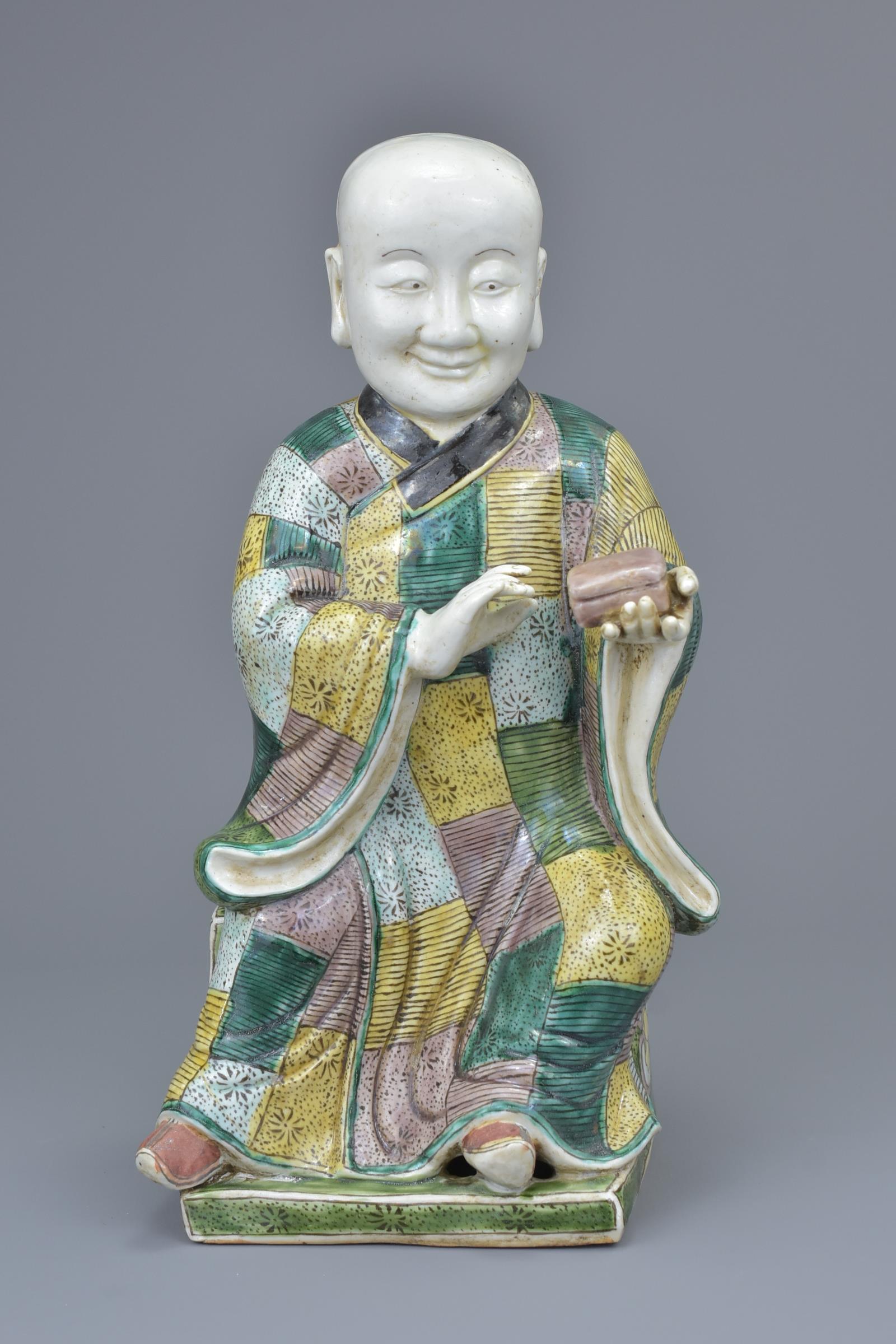 A Chinese 19th C. Famille verte porcelain figure of a 'doctor'