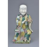 A Chinese 19th C. Famille verte porcelain figure of a 'doctor'
