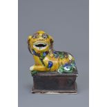 A Chinese 19/20th C. sancai biscuit porcelain figure of a Foo Dog