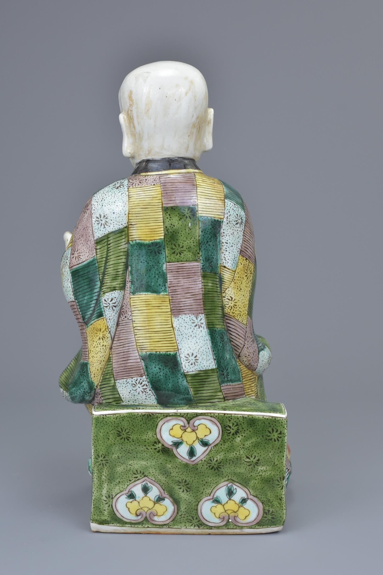 A Chinese 19th C. Famille verte porcelain figure of a 'doctor' - Image 3 of 6