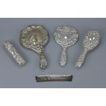 An English antique silver dressing set