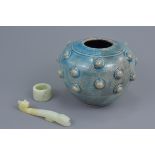 An Asian blue glazed pottery jar