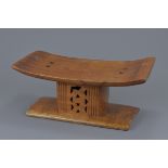 A carved wooden seat