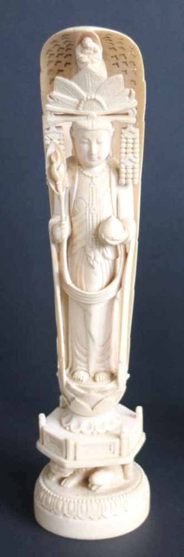 Chinese ivory figure of an immortal with peachIn his headdress, a figure of a Putai Circa 1900 Crack