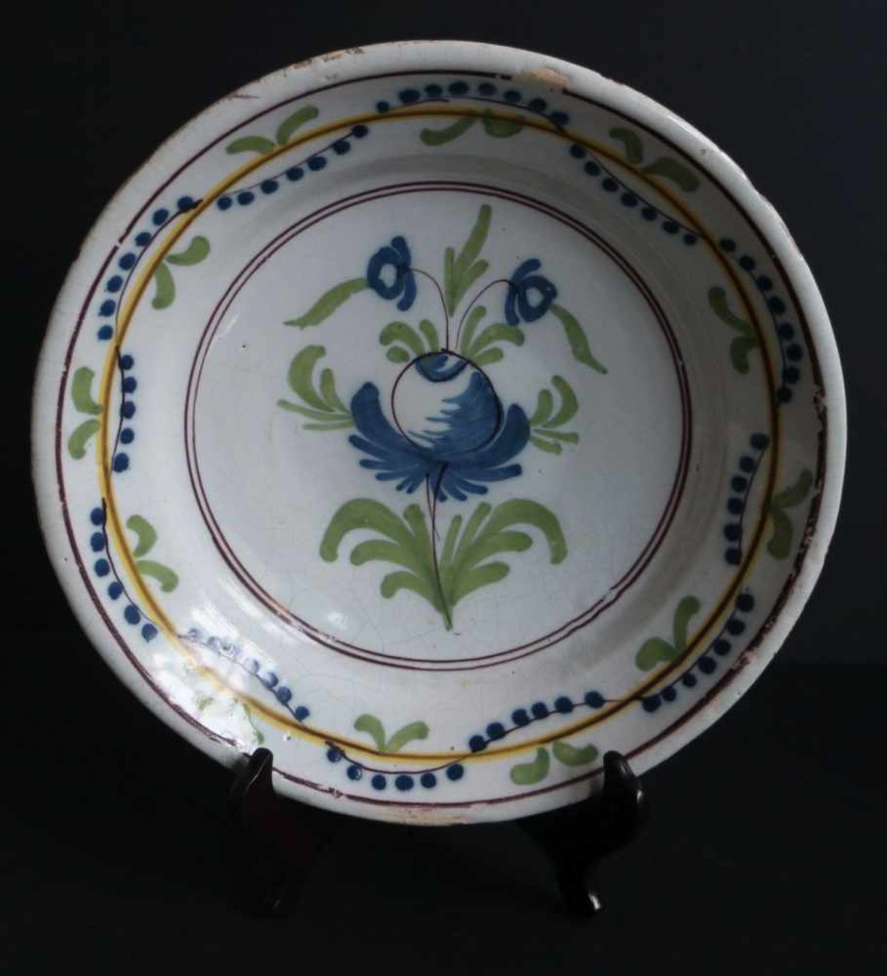 Flemish dishCeramics Flanders - Northern France Flower in the center, circles, garland Polychromydia