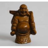 Netsuke Tiger's eye Ivory figure of a Hotei, carrying a gourd and knapsack Japan early 20th century