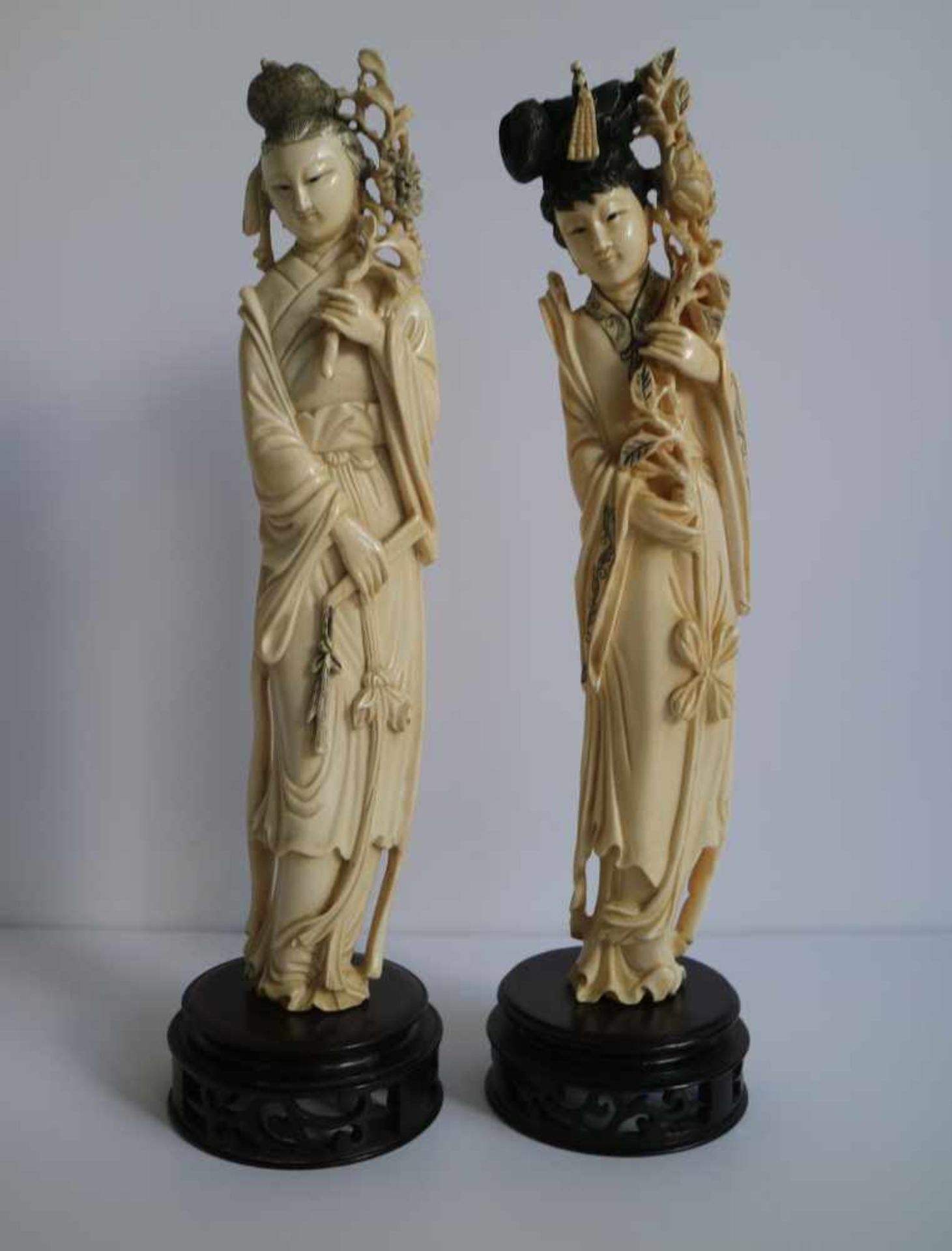 Chinese ivory figures He Xiangu one with flowers and one with blossom branch and fan, Republic