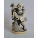 Ivory Okimono Depicting Ebisu holding his catch, Japan H 11,3 cm signed