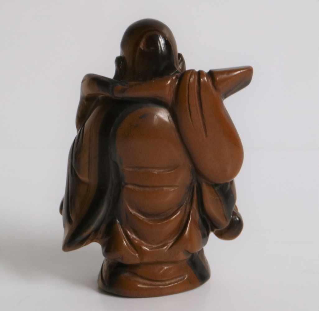 Netsuke Tiger's eye Ivory figure of a Hotei, carrying a gourd and knapsack Japan early 20th century - Image 3 of 5