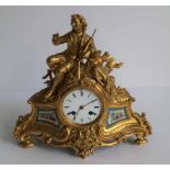 Fire gilded clock with Sèvres plaques H 31 B 32 cm