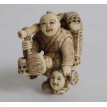 Carved netsuke very fine carved netsuke of a basket seller intended as an okimono H 5,2 cm private