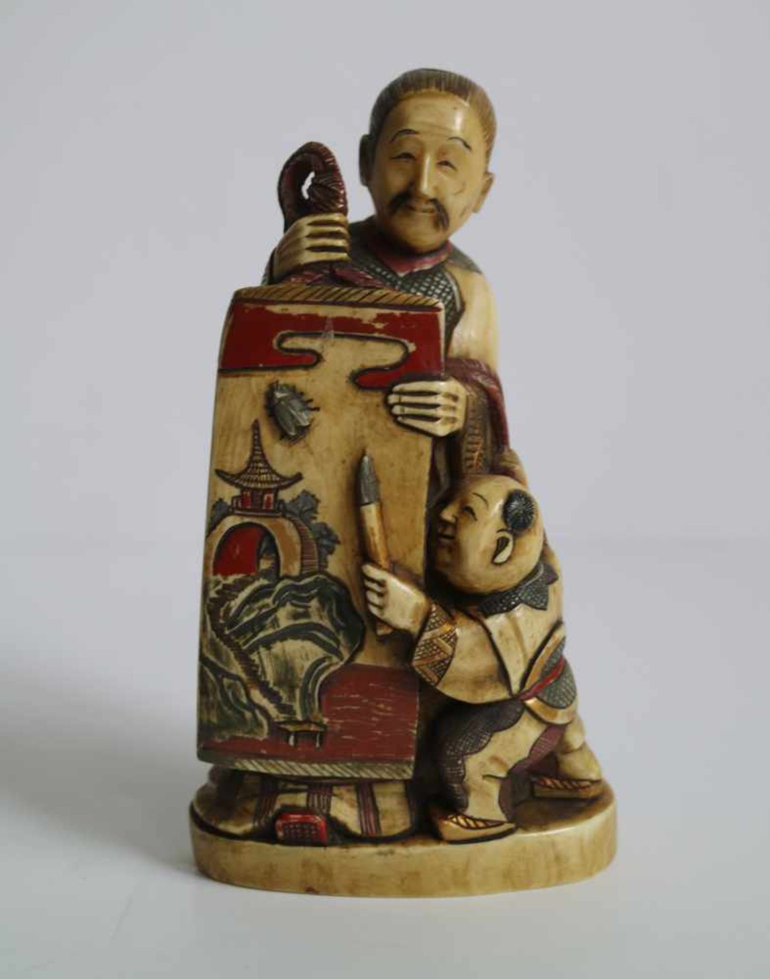 Carved hippopatamus tooth Okimono of an art teacher and his pupil, polychromed Probably Kyoto 1920'