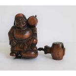 Wooden 3 section inro depicting Daikoku Daikoku, God of thunder holding his mallet, Japan 20th