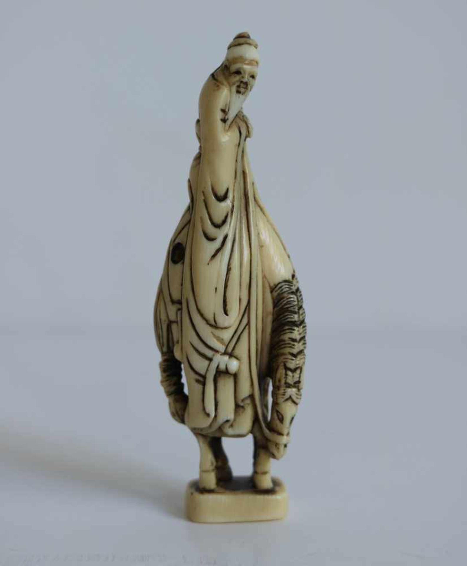 Ivory netsuke of a sennin on a tall horse Japan, Taisho period H 80 cm Signed