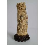 Mammoth ivory Guanyin carving of Guanyin with her attendants China circa 1960's H 20 cm (with base)