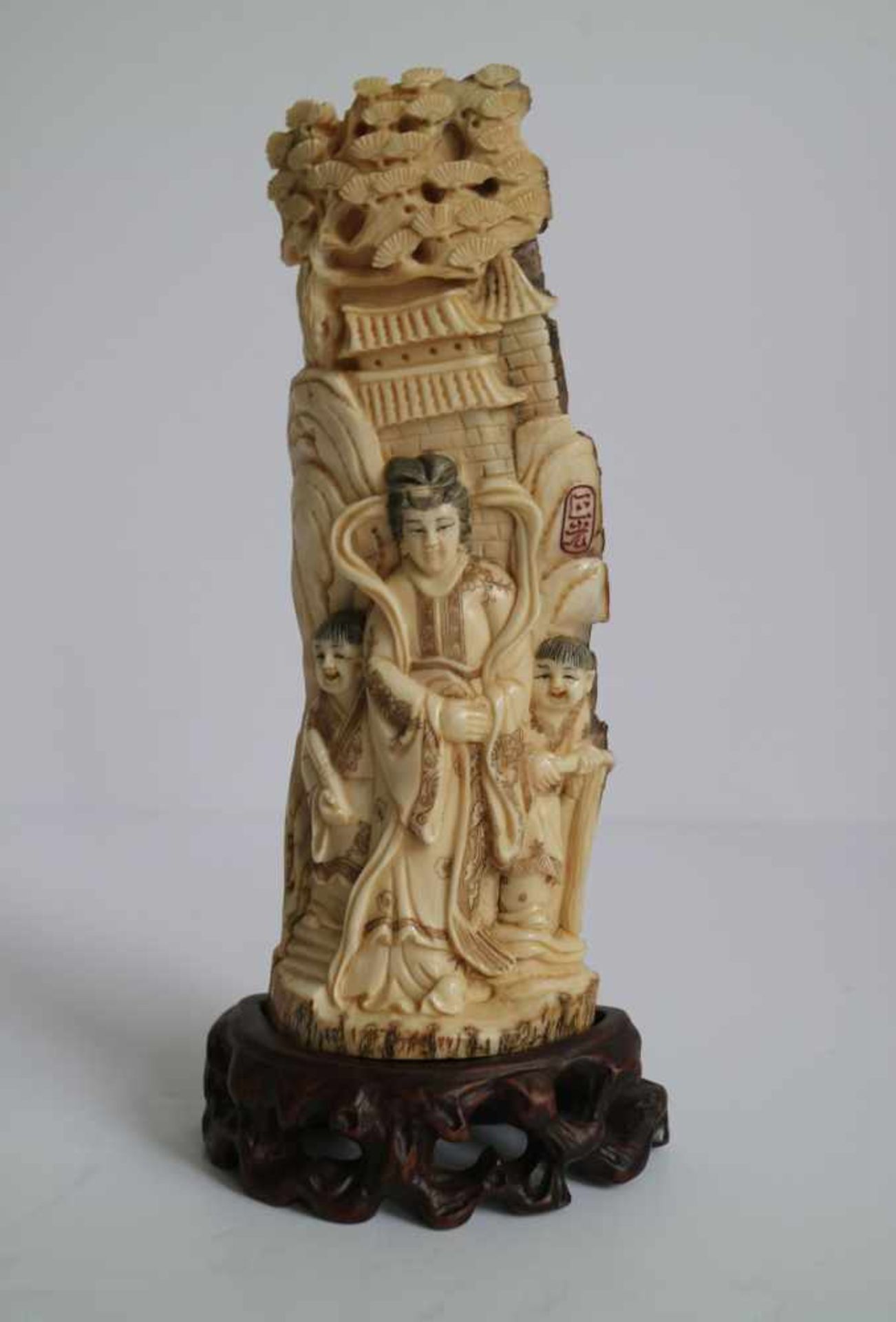 Mammoth ivory Guanyin carving of Guanyin with her attendants China circa 1960's H 20 cm (with base)