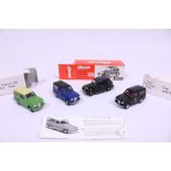 A Collection of Four Die-Cast Austin Cars & Vans
