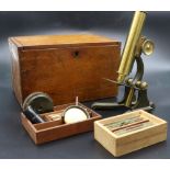 A 19th century brass microscope by J T Slug Manchester