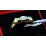 An 18k Yellow Gold, Opal & Diamond Ring