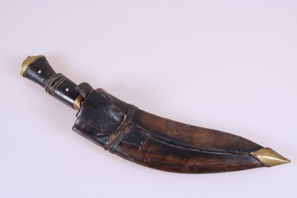 A Kukri in Leather Scabbard