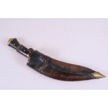 A Kukri in Leather Scabbard