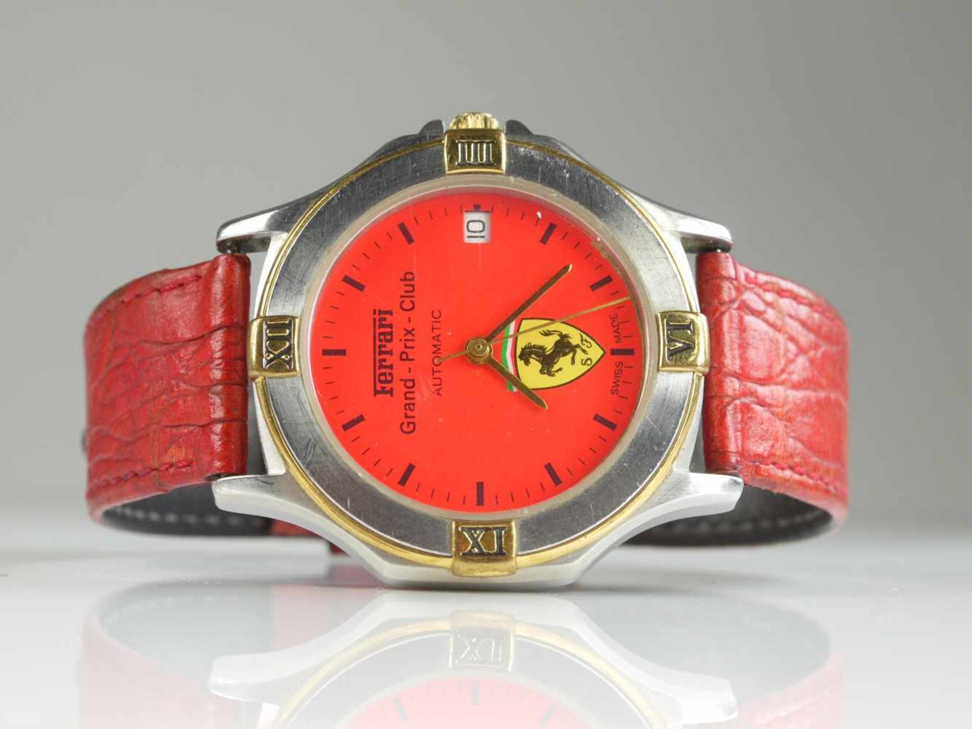 HAU Ferrari Grand Prix ClubGehäuse Stahl/Gold mit Glasboden. Automatikwerk mit Stunden, Minuten,