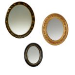 (3) Victorian japanned and Giltwood Oval Mirrors