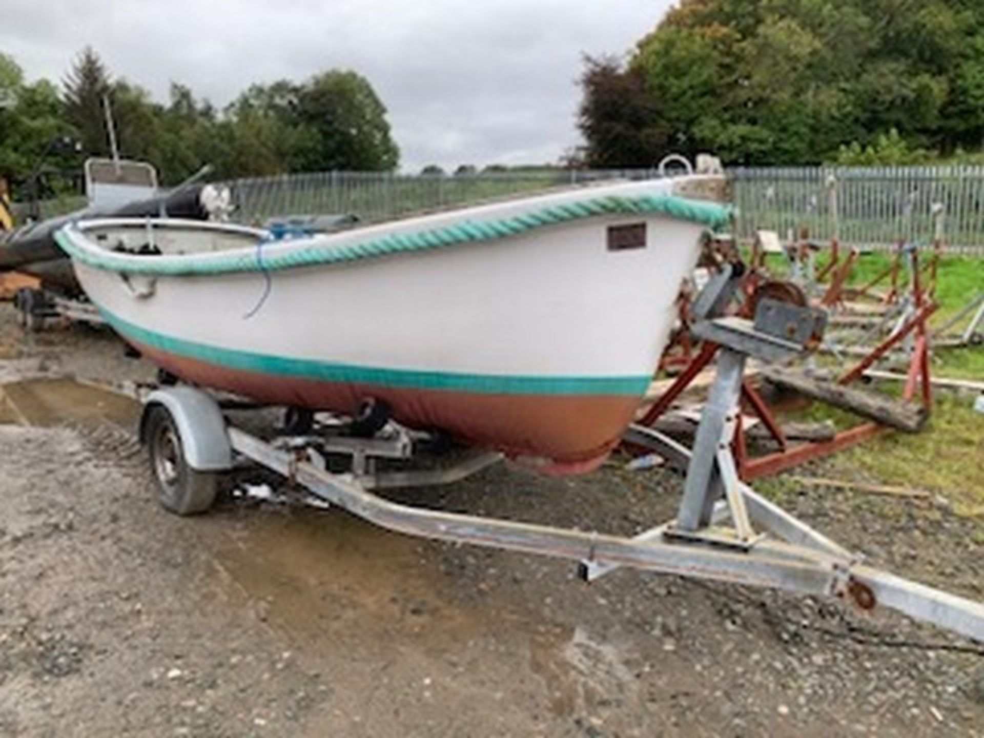 IN BOARD FIBRE GLASS FISHING BOAT - DIESEL VOLVO ENGINE C/W TRAILER