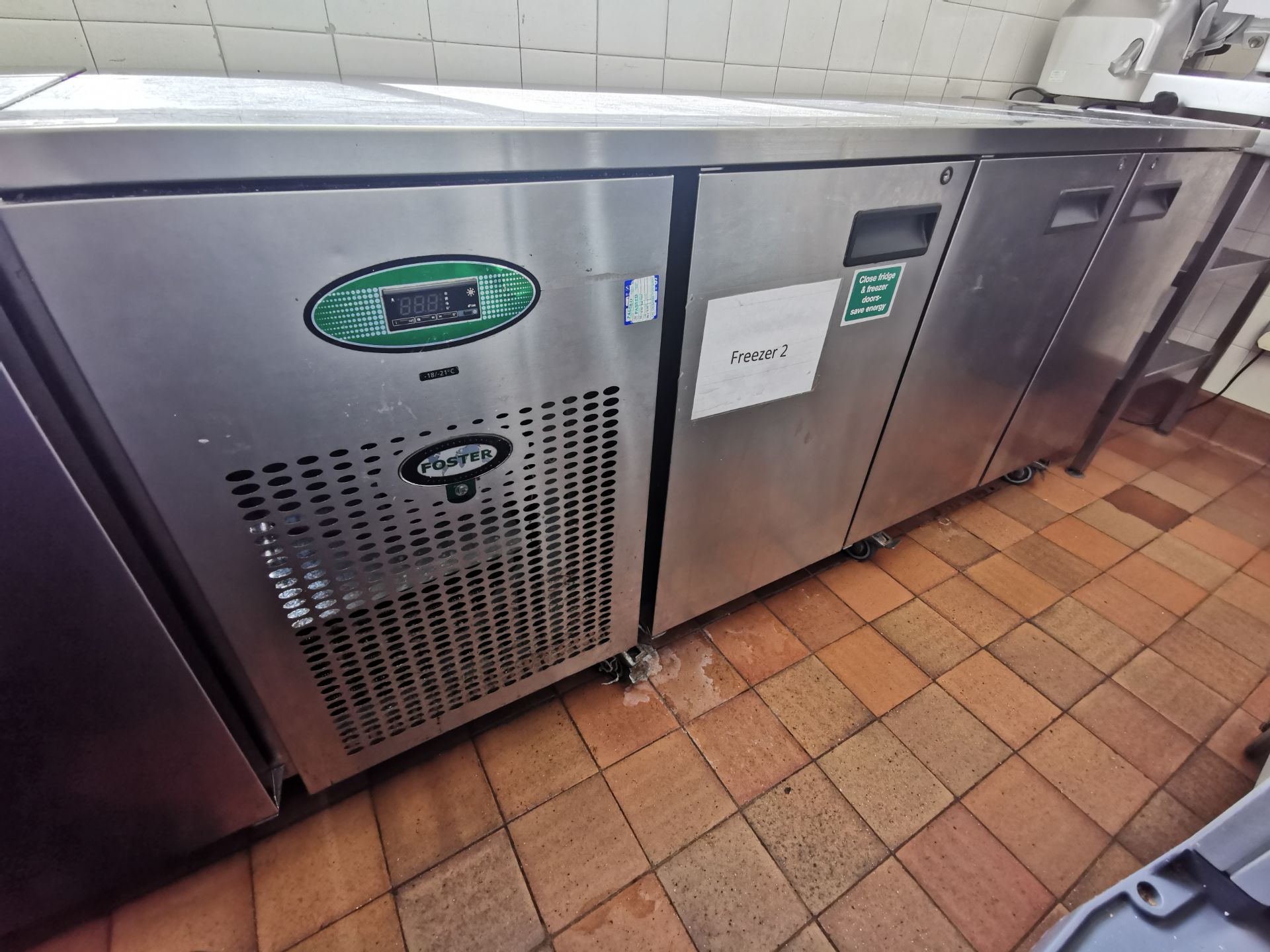 Foster Stainless steel kitchen worktop with built in fridge freezer