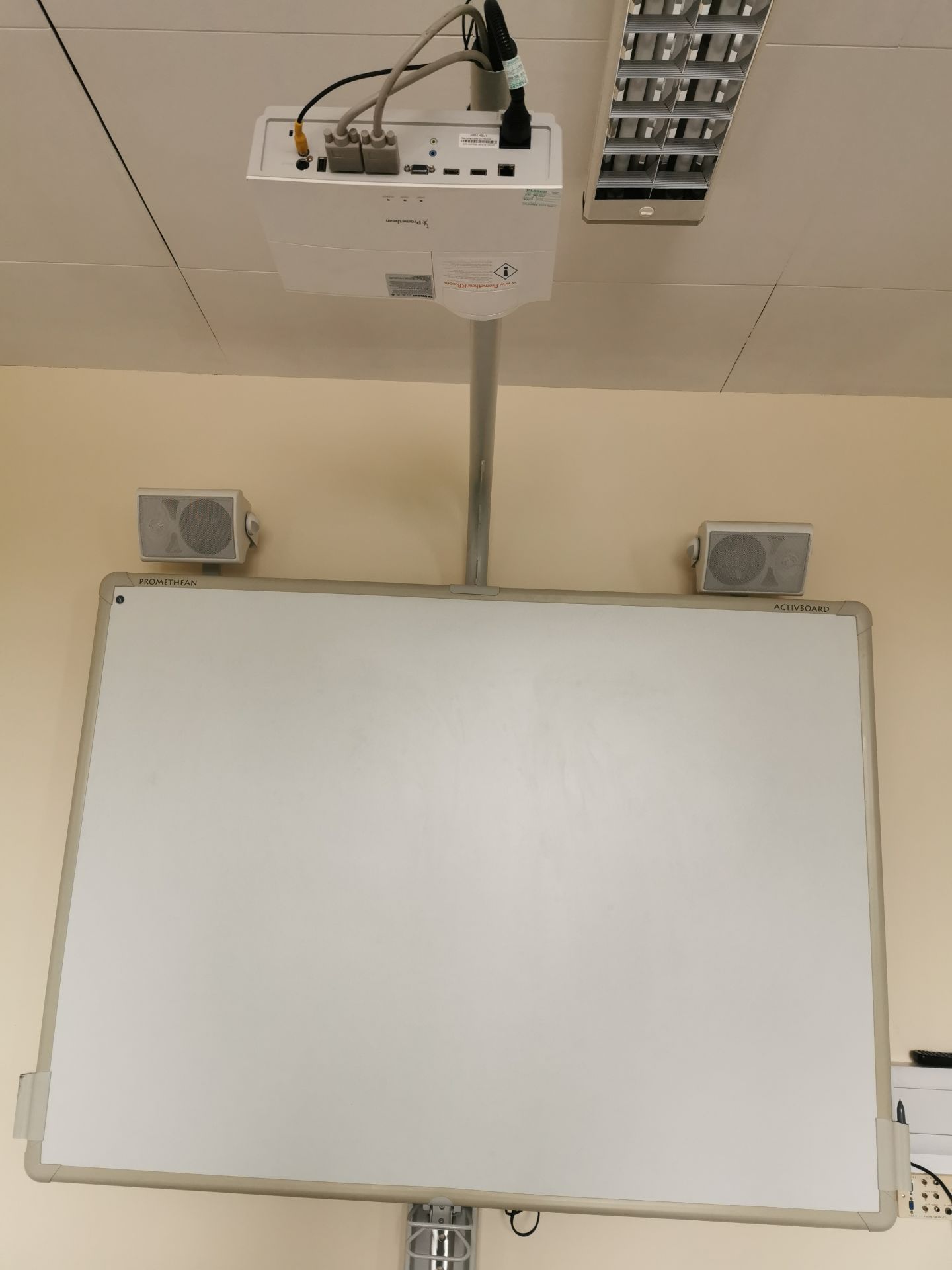 Promethean active board, projector and speakers [on stand]