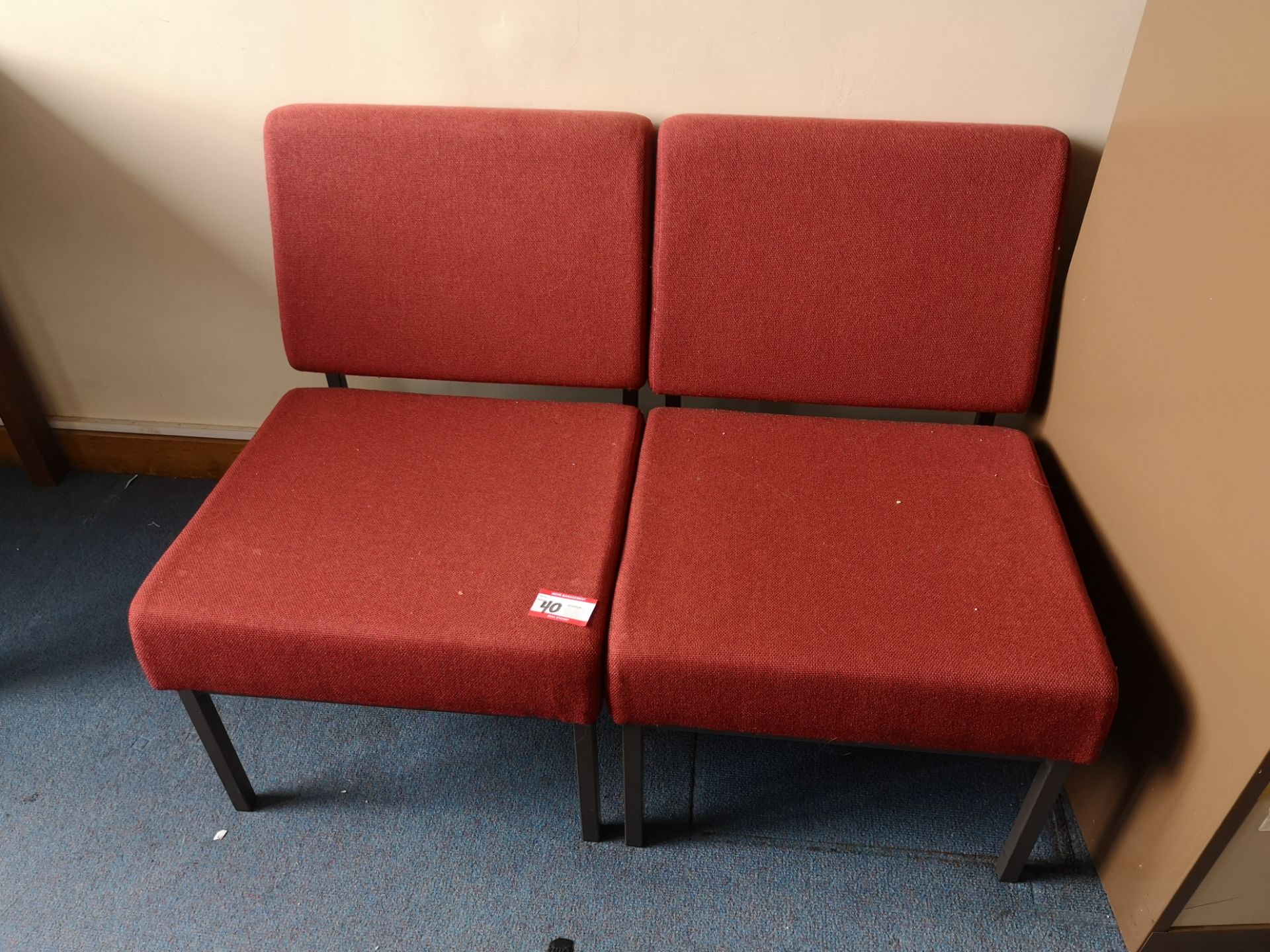 2x Red upholstered lounge chairs