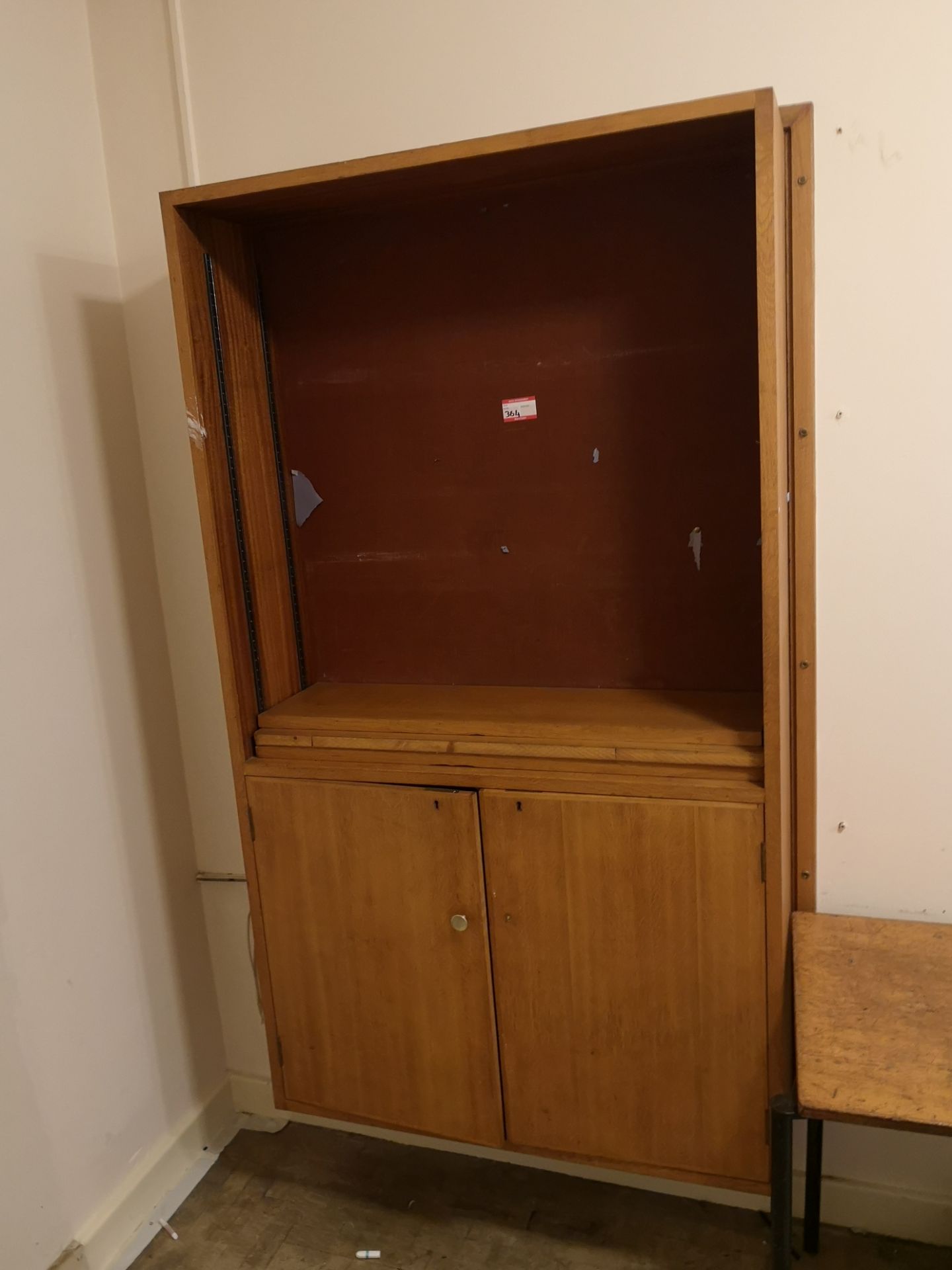 Vintage tall wooden cabinet with doors