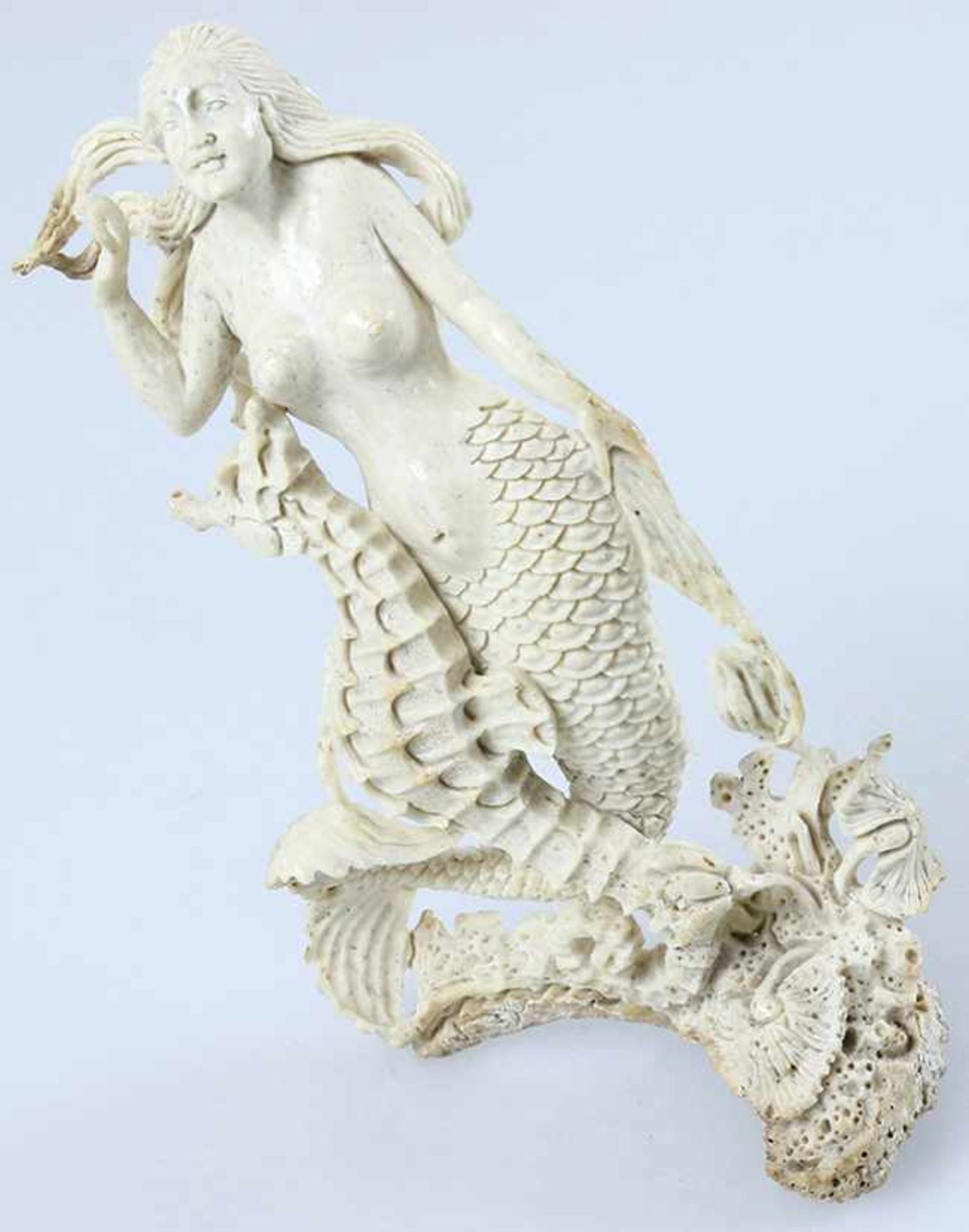 A stunning carved Mermaid with a seahorse at her side. Watch her fishy skin, real craftmanship!