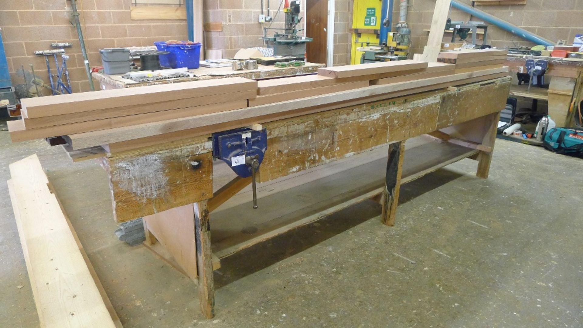 1 wooden work bench with a wood workers vice fitted, approx 3.4m x 1m (the wood shown on top of