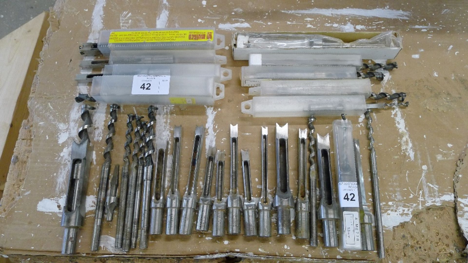 A quantity of various chisel mortise bits