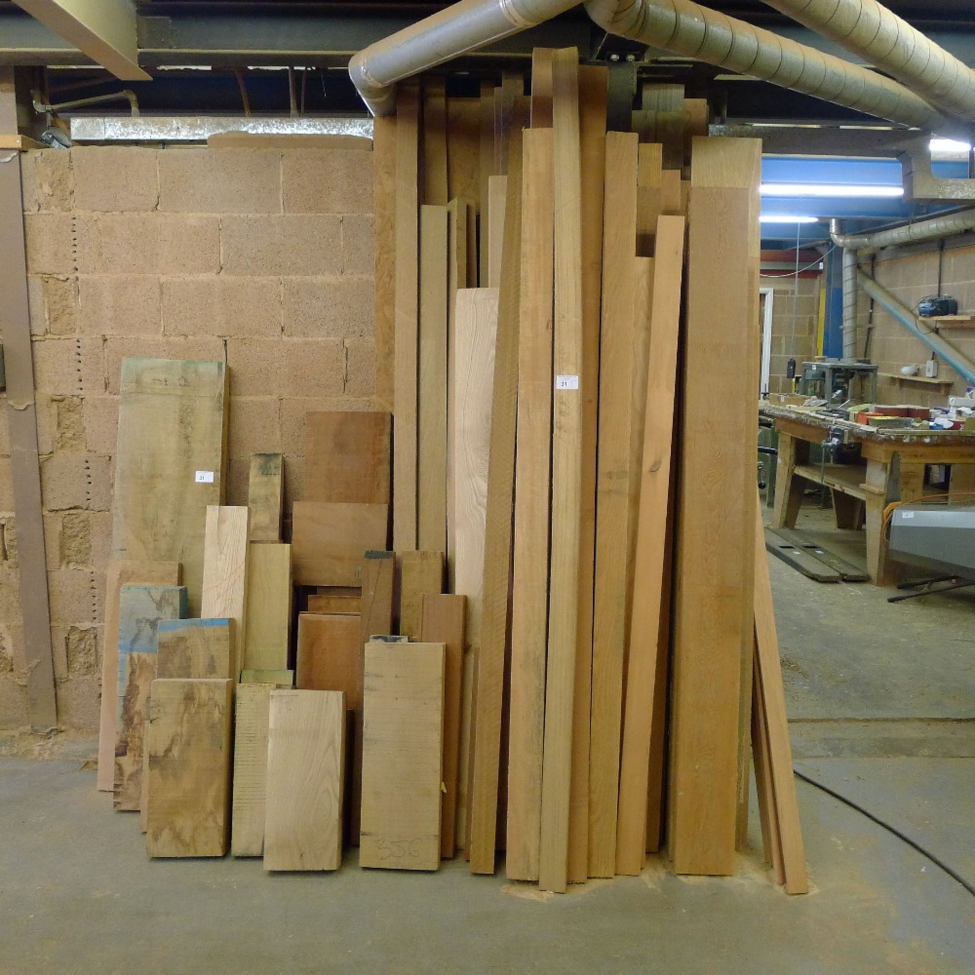 A quantity of various timber including European oak, beech, sapele, ash, Douglas Fir etc. On left