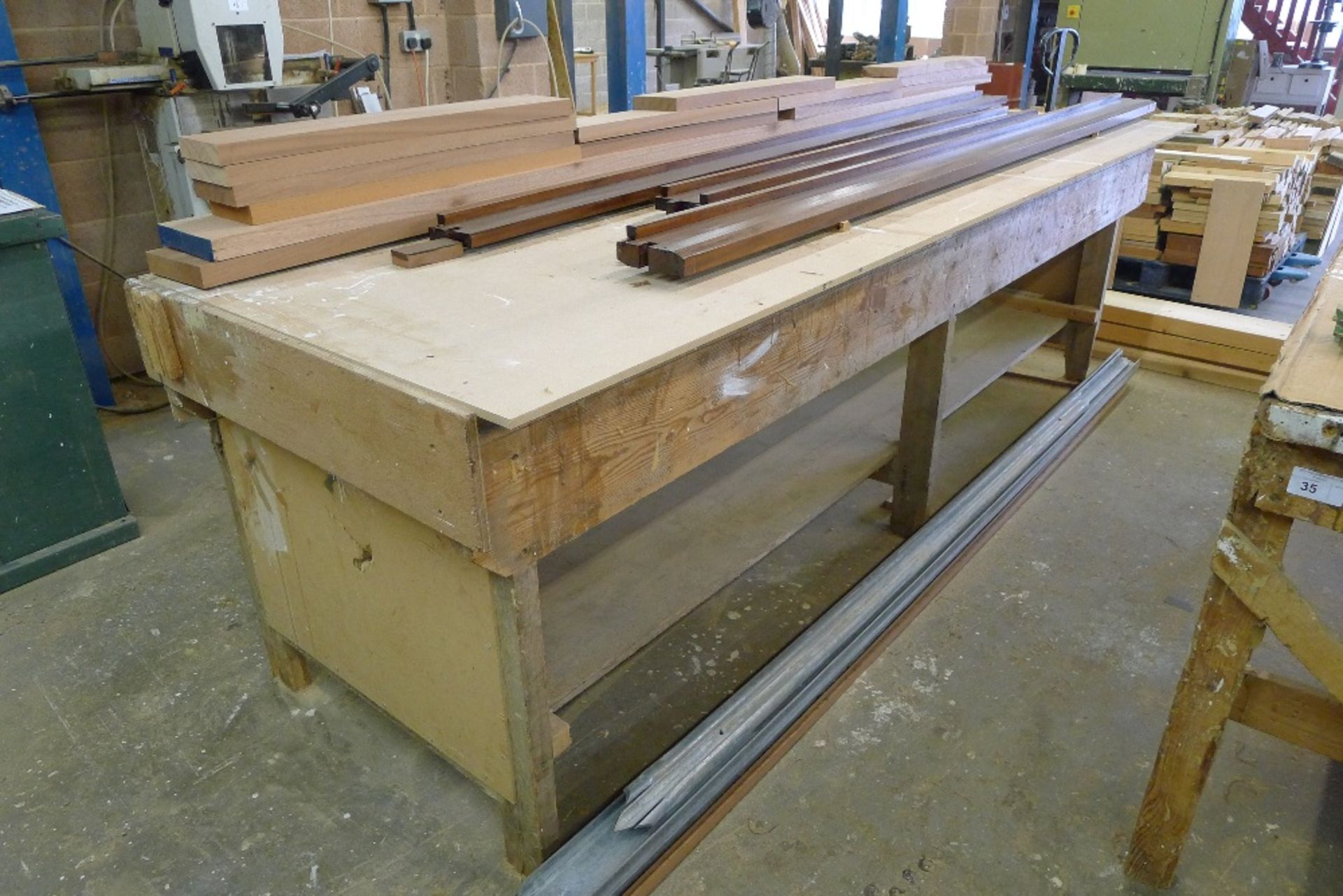 1 wooden work bench with a wood workers vice fitted, approx 3.4m x 1m (the wood shown on top of - Image 2 of 2