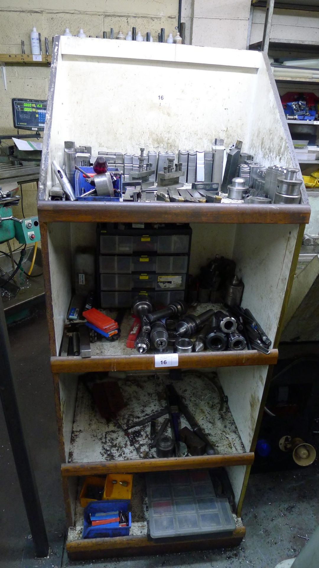 1 rack containing various tooling including chuck jaws, tool holders, spinning centres, collet