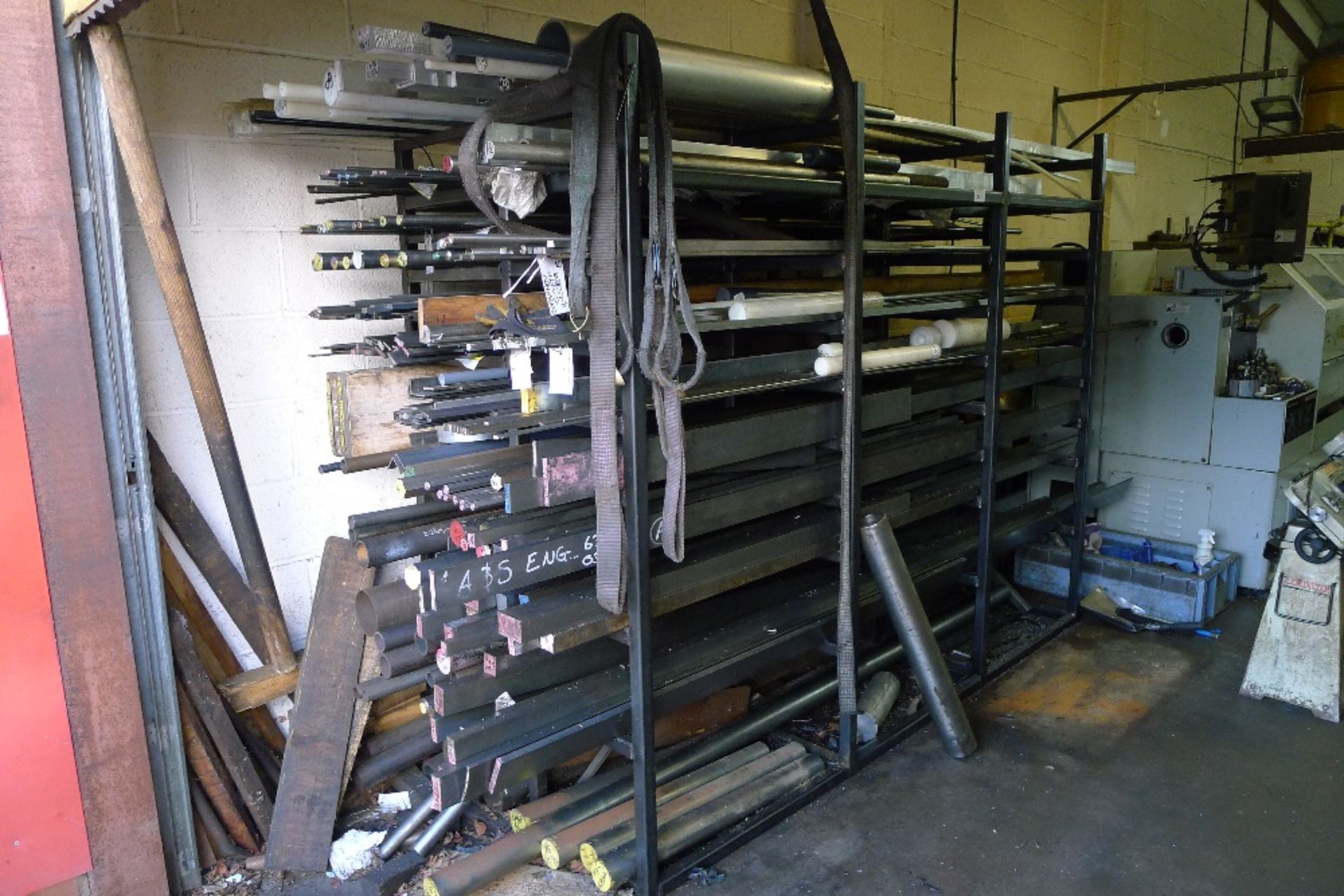 1 steel stock storage rack containing a quantity of flat bar, round bar, plastic / nylon / metal