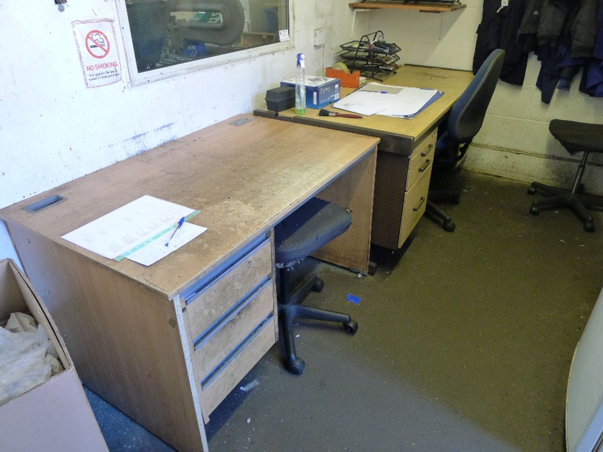 Various items in the front office including several desks, a boltless metal stores type rack, a