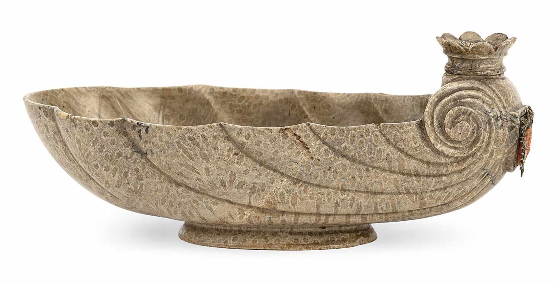 A BAROQUE CUT GRAY SERPENTINE STONE SHELL SHAPED FOOTED BOWL, late 17th century. At the back a